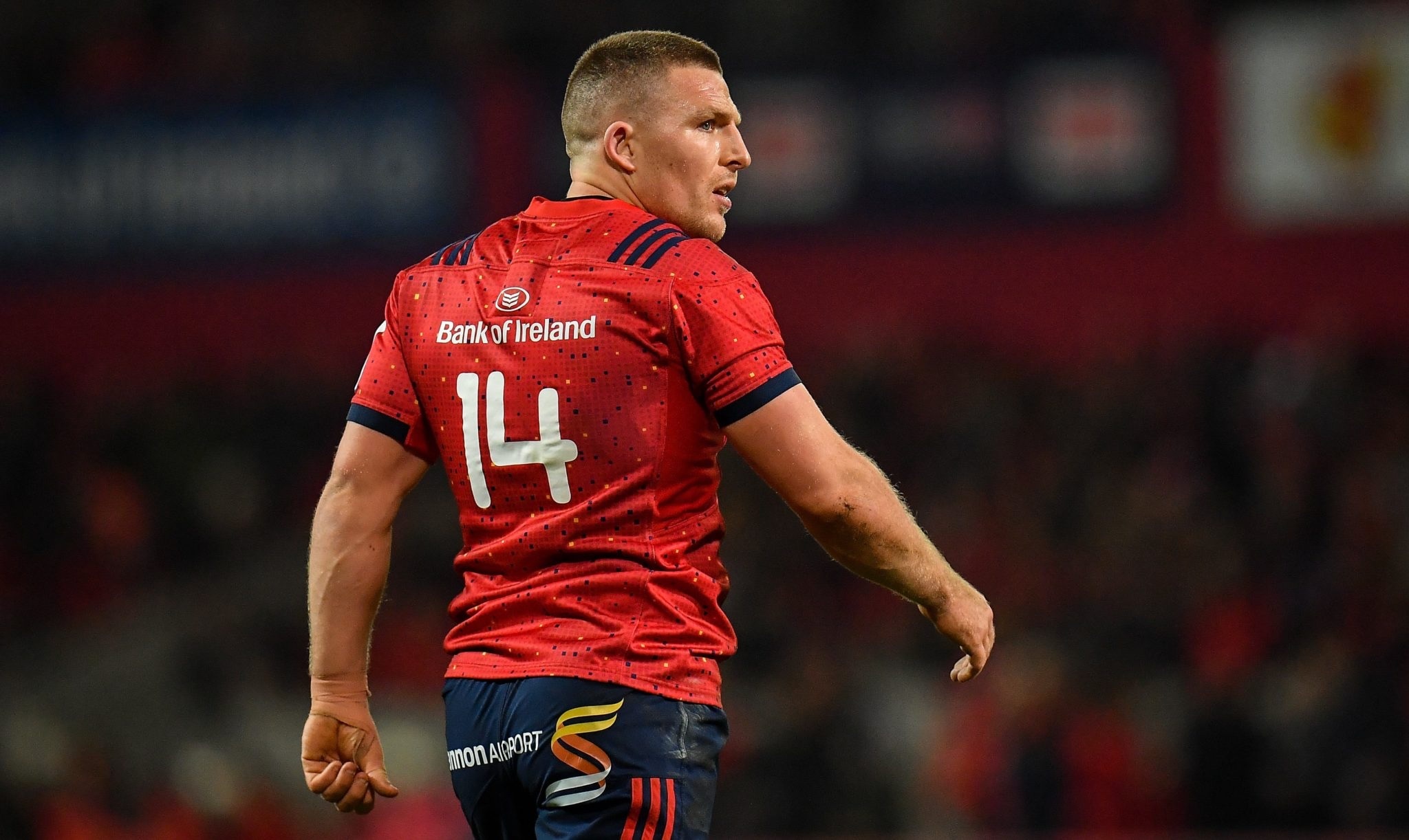 Andrew Conway in the Munster 14 jersey, looking back over his shoulder.